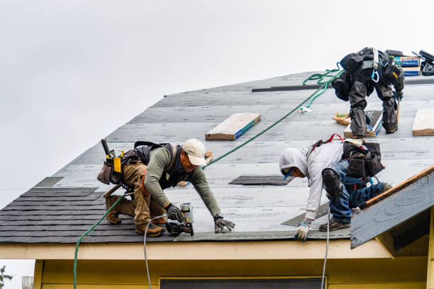 Professional Roofing technician working in Russell, MA